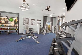 24-Hour fitness center with cardio and weight training equipment